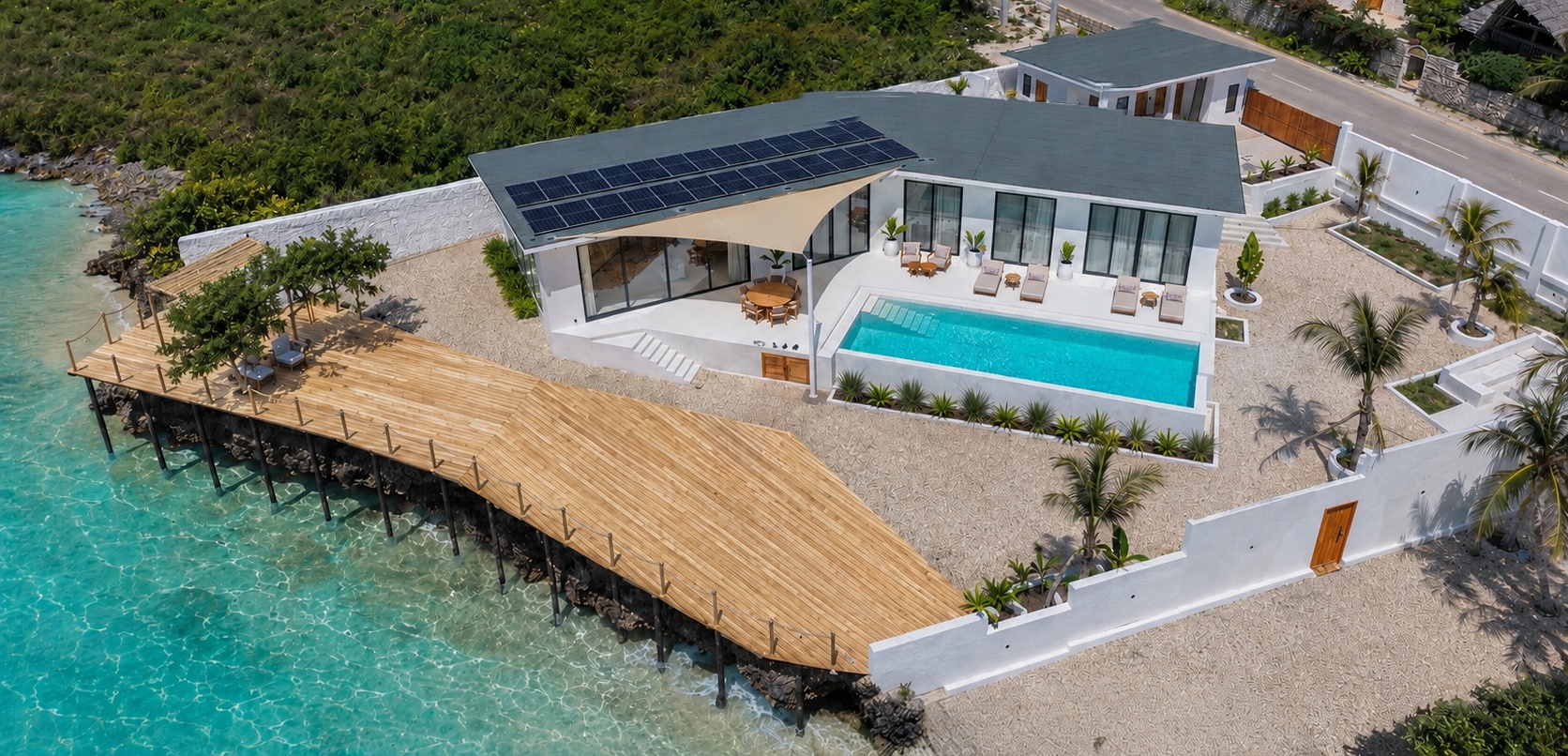 Aerial daytime view of Zuri Cliff villa, timber deck and ocean
