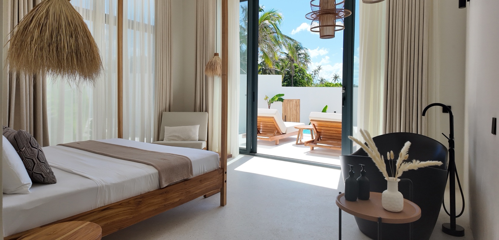 Master bedroom opening onto the pool terrace at Zuri Cliff villa